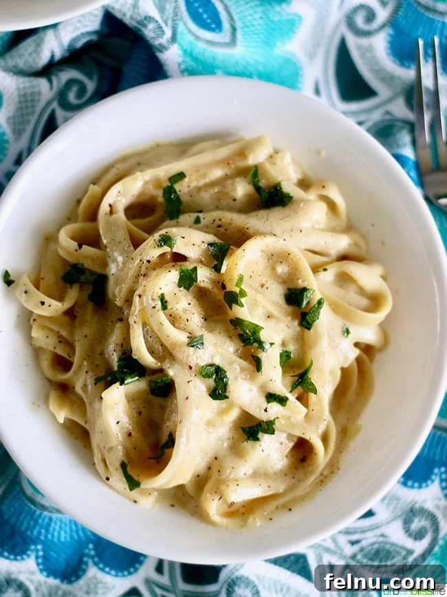 Velvet-Smooth Vegan Fettuccine Alfredo 8 A perfectly plated dish of Dairy-Free Fettuccine Alfredo, ready to be enjoyed