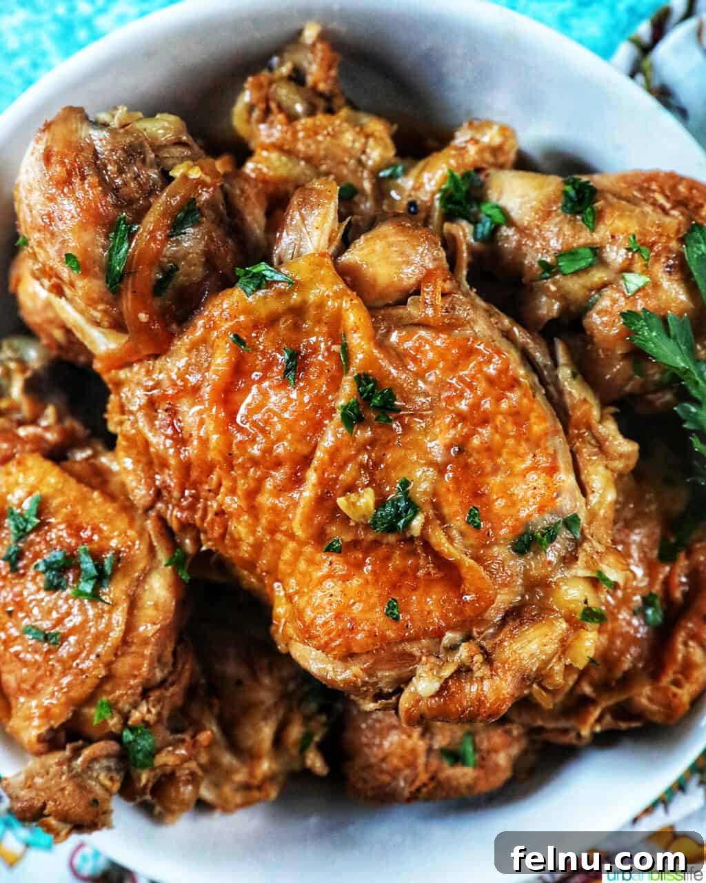 Ultimate Instant Pot Chicken Adobo 2 bowl of Instant Pot Filipino Chicken Adobo with herbs.