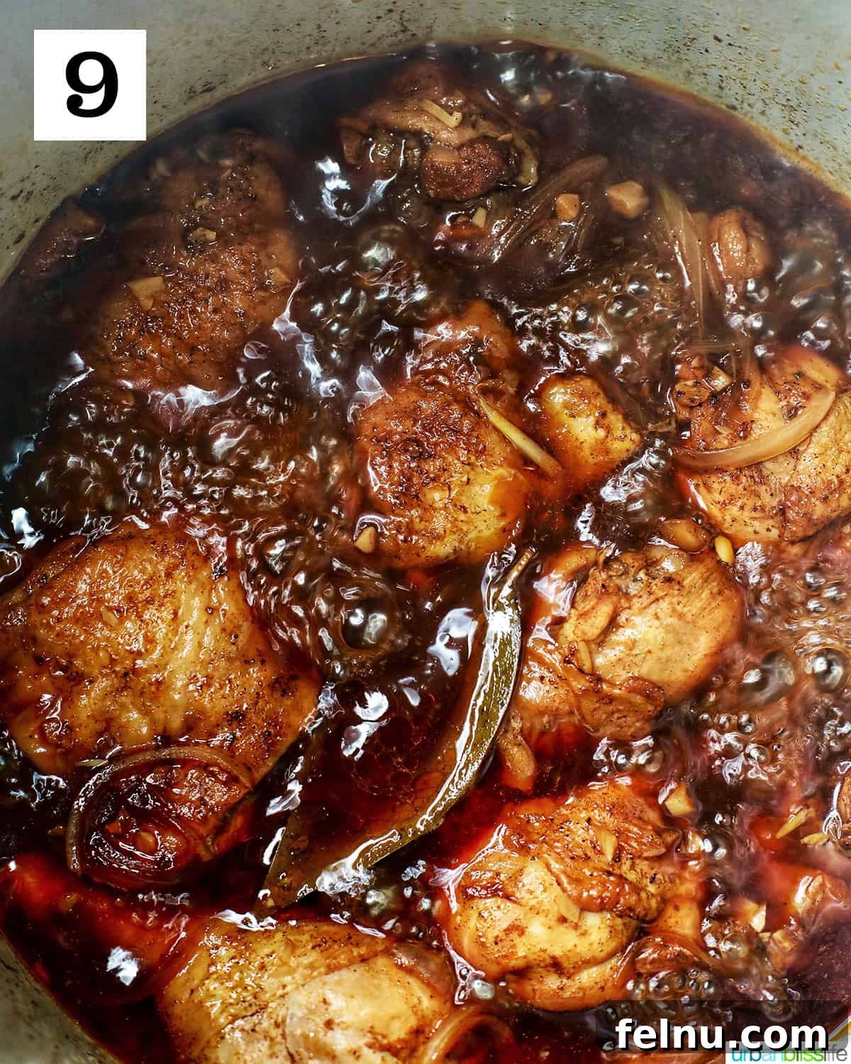 Ultimate Instant Pot Chicken Adobo 14 adobo chicken boiling in an Instant Pot to create a thicker adobo glaze.