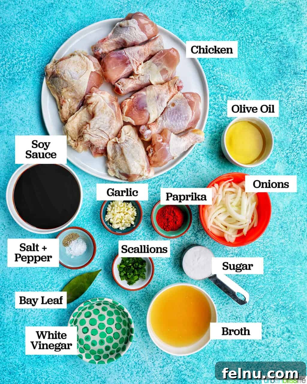 Ultimate Instant Pot Chicken Adobo 4 bowls of several ingredients to make Instant Pot Chicken Adobo on a blue table.