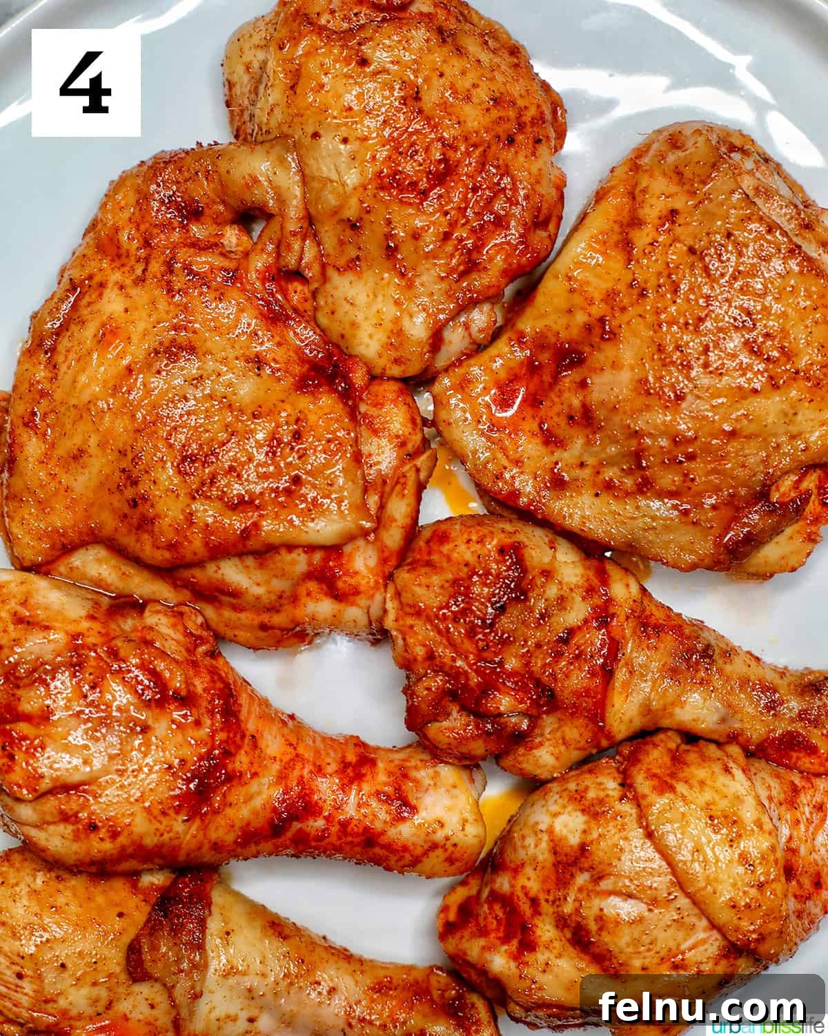 Ultimate Instant Pot Chicken Adobo 9 browned seasoned adobo chicken pieces transferred to a plate.