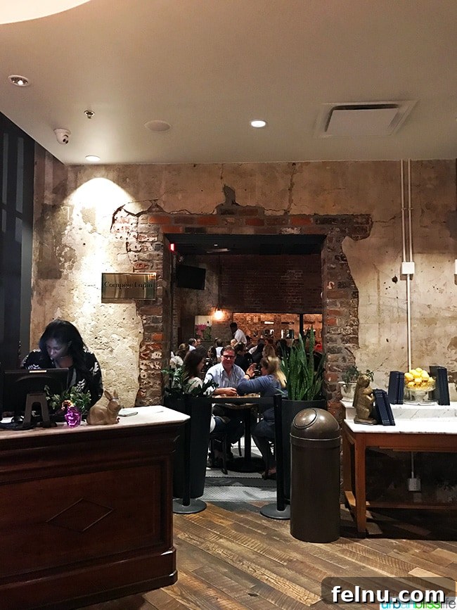 Where Caribbean Spice Meets Creole Soul at Compère Lapin New Orleans 2 Compere Lapin restaurant in New Orleans, Louisiana. Exterior or interior view with seating.