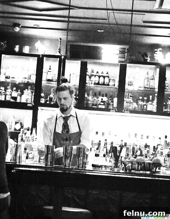 Where Caribbean Spice Meets Creole Soul at Compère Lapin New Orleans 5 Bartender expertly preparing drinks at the Compere Lapin bar.
