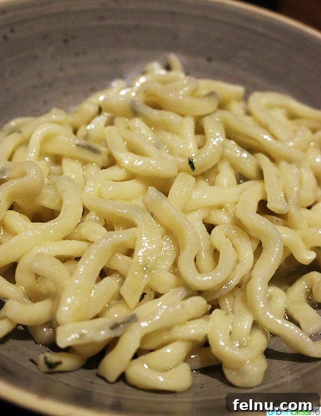 Where Caribbean Spice Meets Creole Soul at Compère Lapin New Orleans 10 Close-up of house-made buttered noodles served at Compère Lapin.