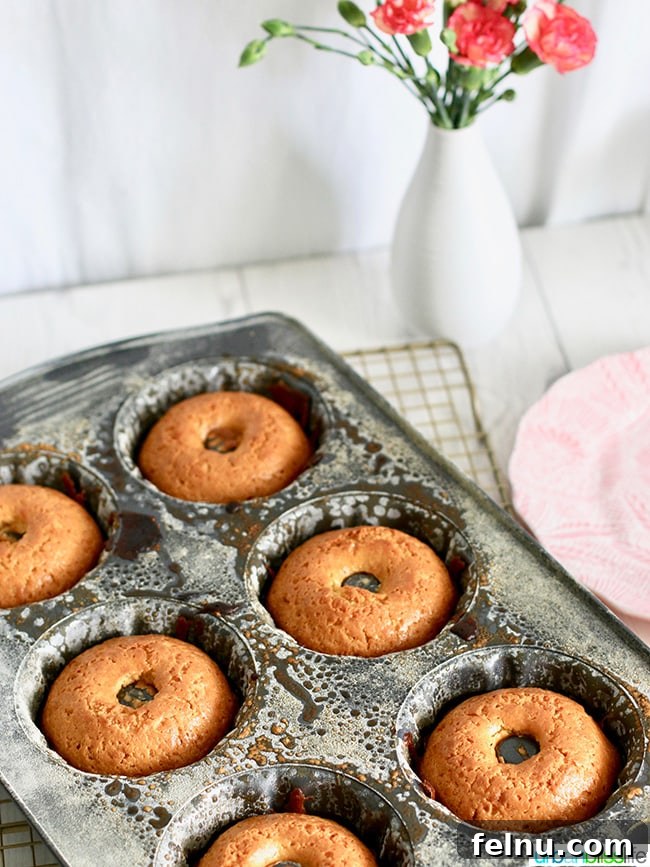 Citrus Kissed Mini Bundt Cakes 4 Mini Citrus Bundt Cakes baking in a bundt pan