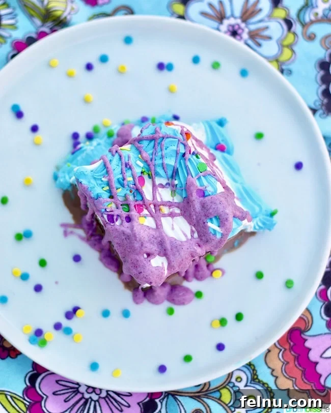 Effortless DIY Unicorn Hard Shell Topping 12 Overhead shot of ice cream cake slice with magic shell