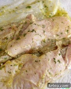 Simple Lemon Herb Grilled Chicken marinating in a bag.