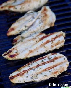 Simple Lemon Herb Grilled Chicken on the grill.