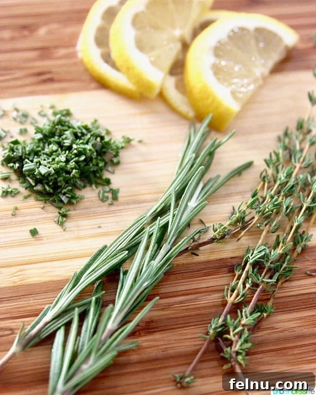 Zesty Lemon Pepper Grilled Chicken 4 Fresh rosemary, thyme, and lemons on a wooden board, ready for grilling.