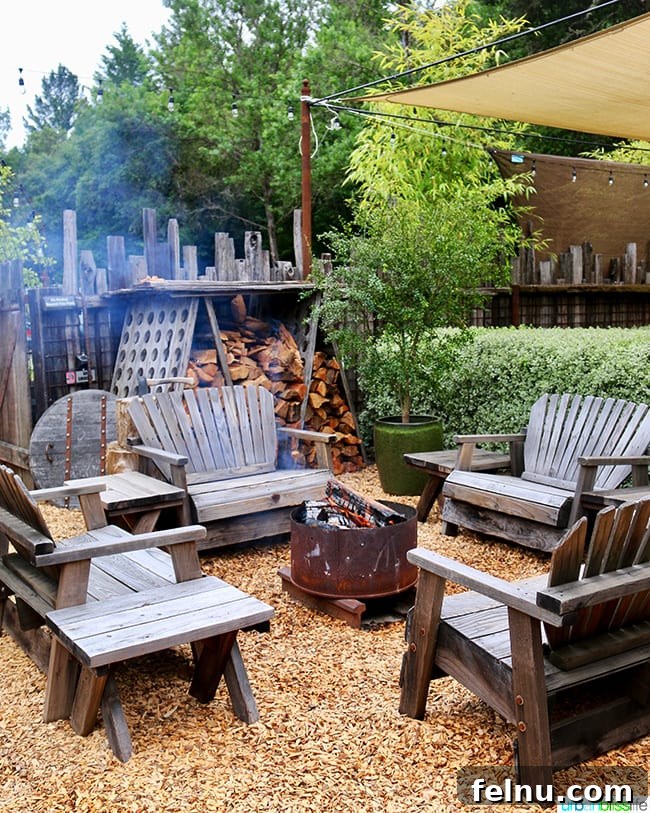 The Puzzled Piglet 5 Cozy outdoor seating area with fire pits at The Bewildered Pig