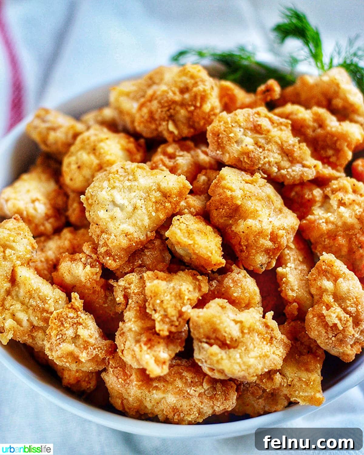 Air Fryer Popcorn Chicken Bites 2 Crispy Air Fryer Popcorn Chicken in a bowl