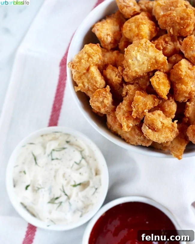 Air Fryer Popcorn Chicken Bites 4 Air Fryer Popcorn Chicken served with various dipping sauces