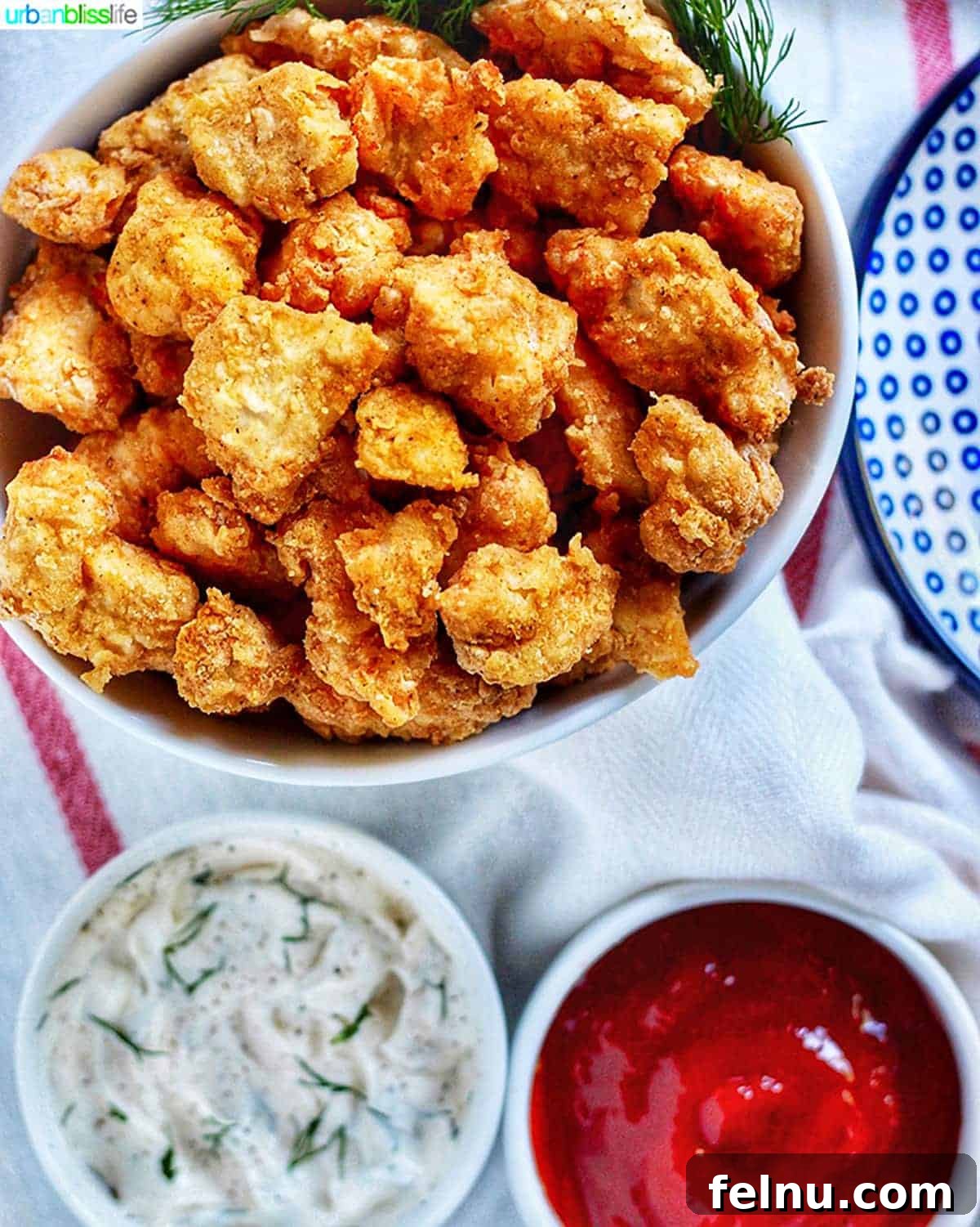 Air Fryer Popcorn Chicken Bites 5 Air Fryer Popcorn Chicken close up with dipping sauces