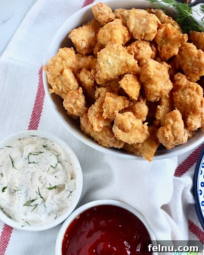Air Fryer Popcorn Chicken Bites 6 Bowl of crispy Air Fryer Popcorn Chicken with dipping sauces