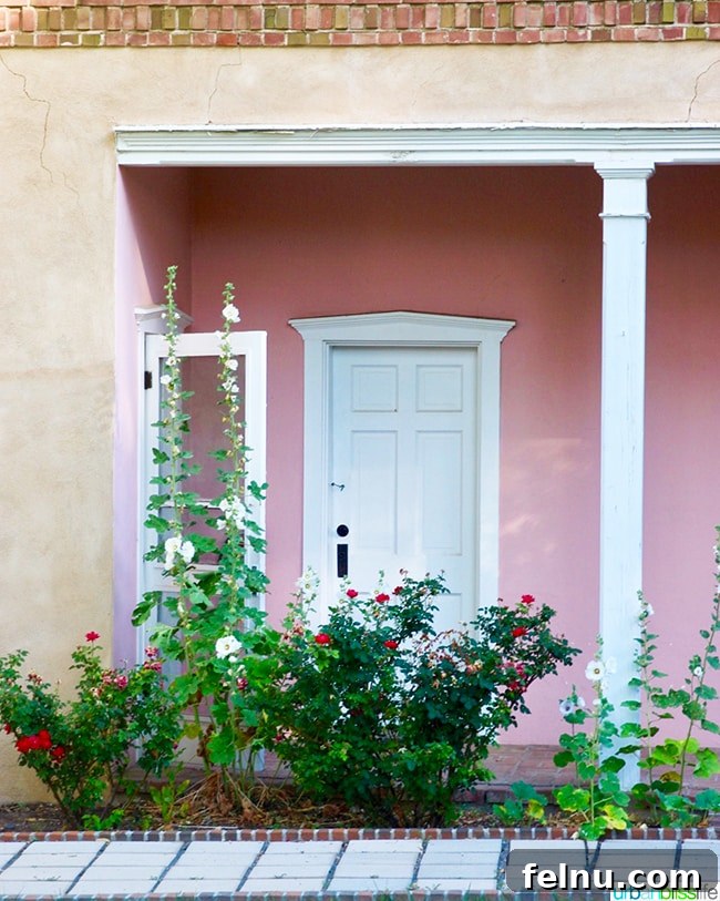 Experience Los Poblanos: Albuquerque's Historic Inn & Organic Farm 10 Charming pink stucco wall and doorway at Los Poblanos Inn