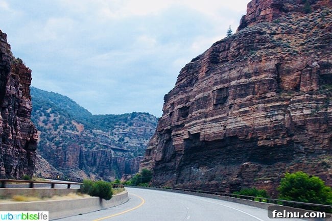 Colorado Peaks and Pavement 8 Colorado highway with towering canyons in the distance