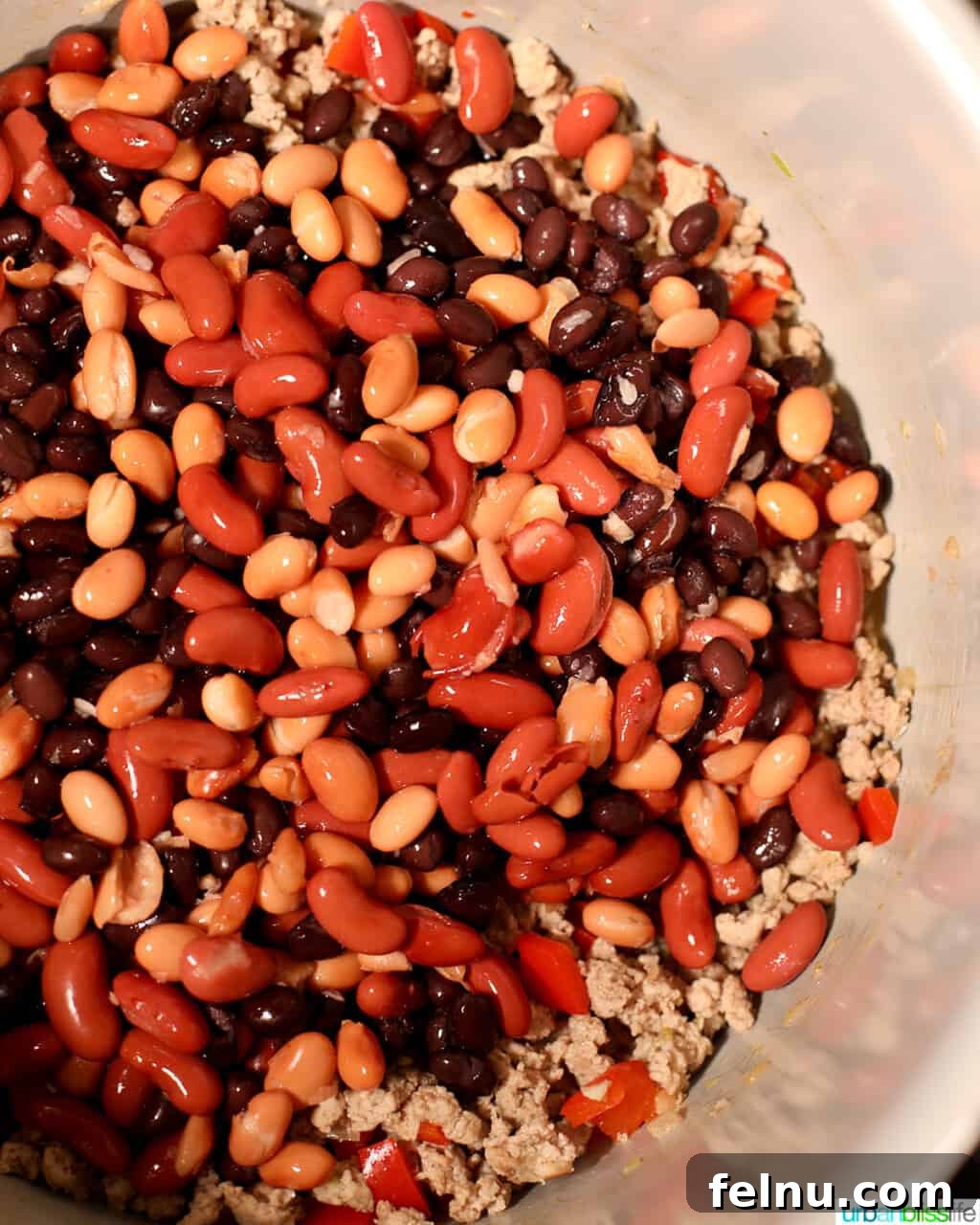 Hearty & Healthy Turkey Chili (Instant Pot Friendly!) 12 Adding beans to the Instant Pot, enriching the chili with texture and flavor.
