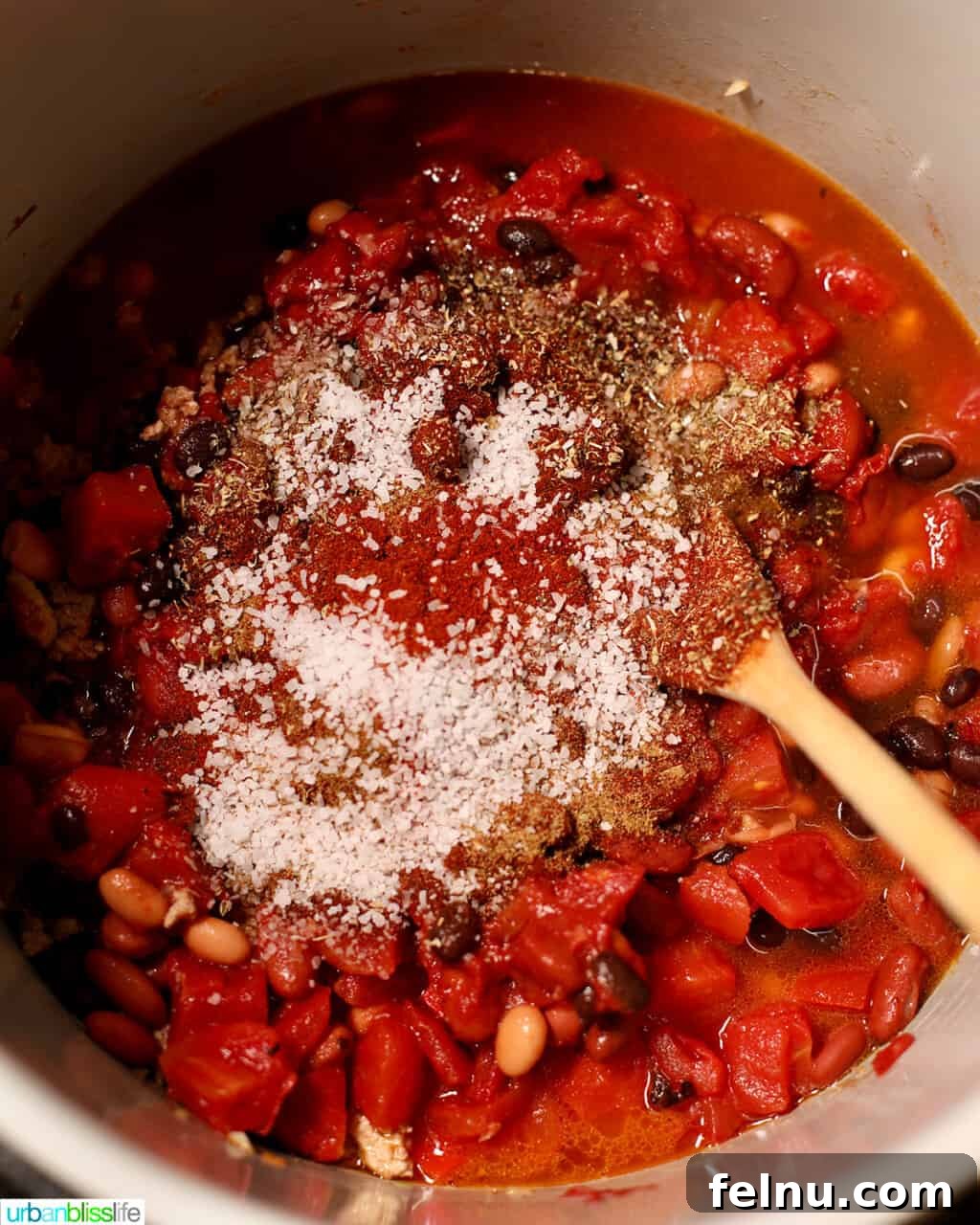 Hearty & Healthy Turkey Chili (Instant Pot Friendly!) 16 Adding salt and pepper to the Instant Pot turkey chili, seasoning it to perfection.