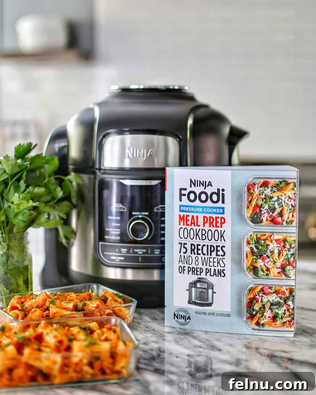 Hearty & Healthy Turkey Chili (Instant Pot Friendly!) 19 Ninja Foodi Cookbook alongside a Foodi and a plate of pasta, highlighting its versatility.