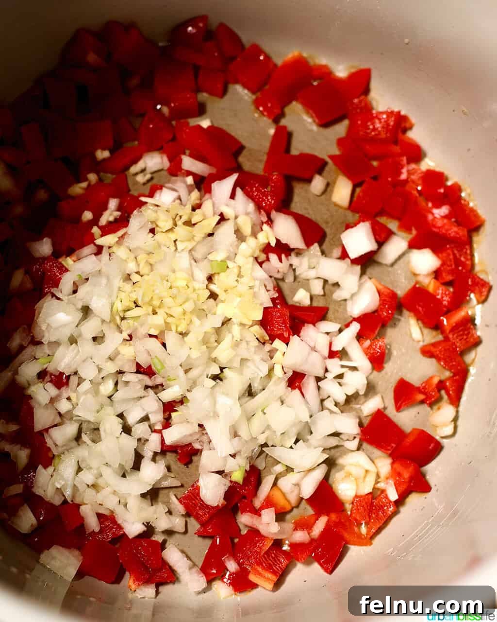 Hearty & Healthy Turkey Chili (Instant Pot Friendly!) 8 Adding diced peppers, onions, and garlic to the Ninja Foodi for sautéing.