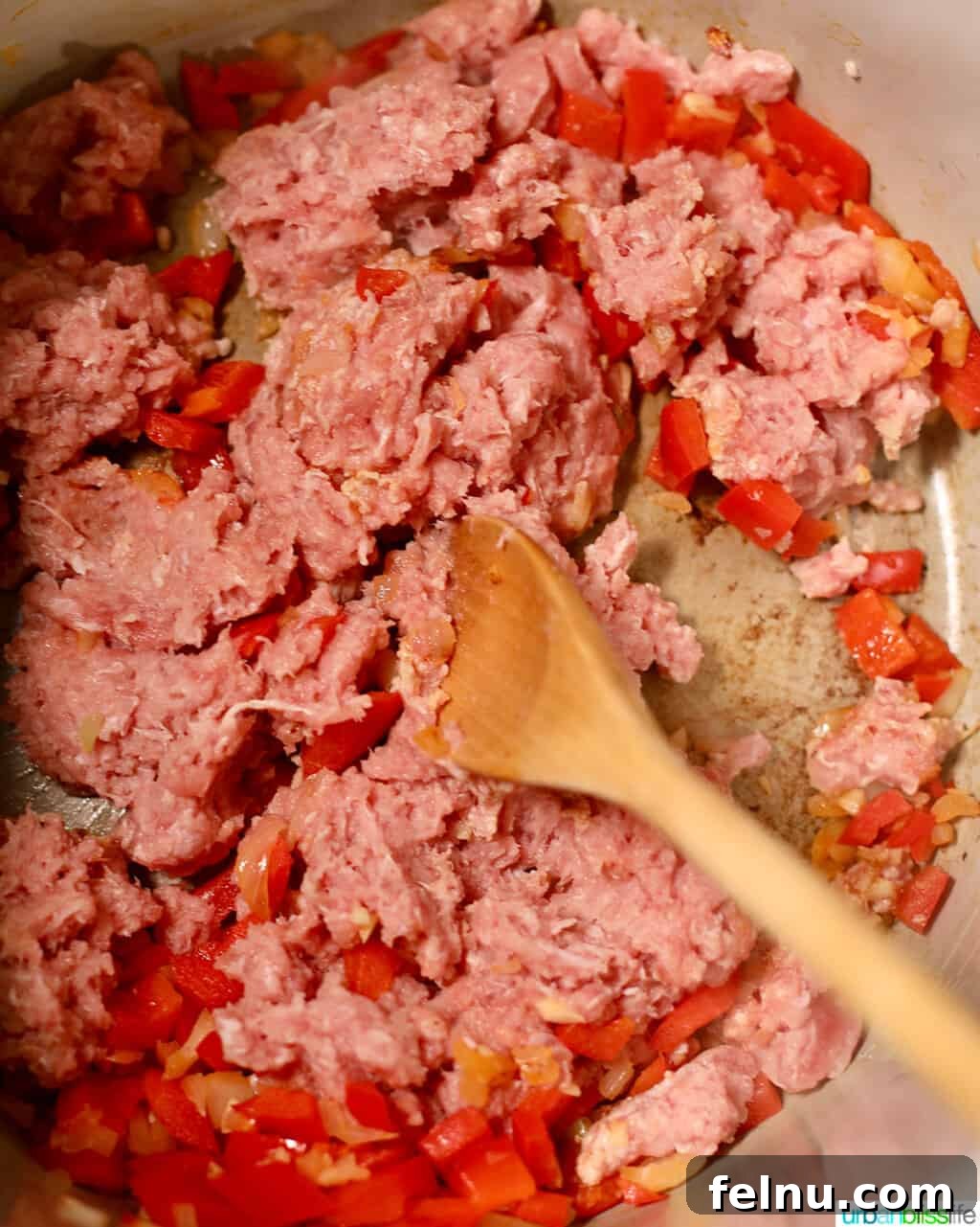 Hearty & Healthy Turkey Chili (Instant Pot Friendly!) 10 Breaking up the ground turkey in the Instant Pot to ensure even cooking.