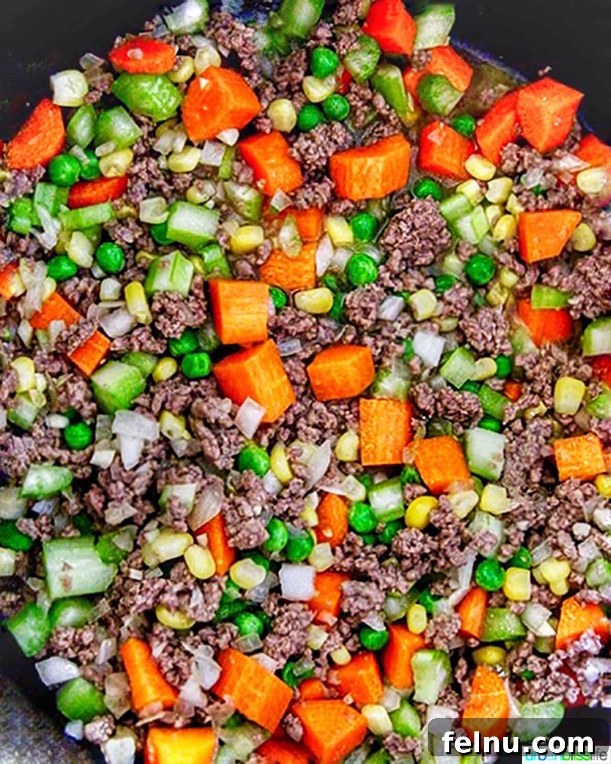 Hearty Dutch Oven Shepherd's Pie 4 Close-up of the vegetables and ground beef mixture for the Shepherd's Pie filling.