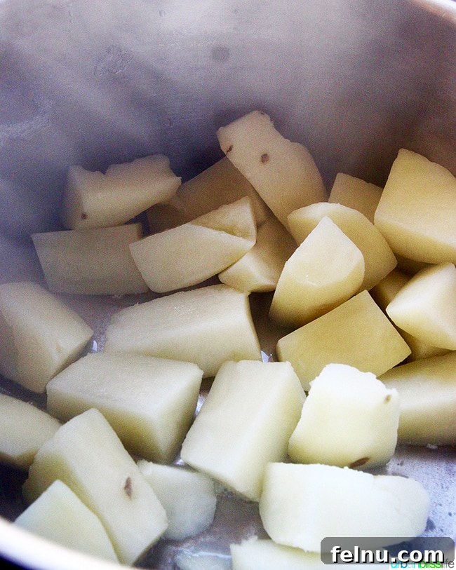 Hearty Dutch Oven Shepherd's Pie 7 Peeled and cubed baking potatoes ready for boiling.