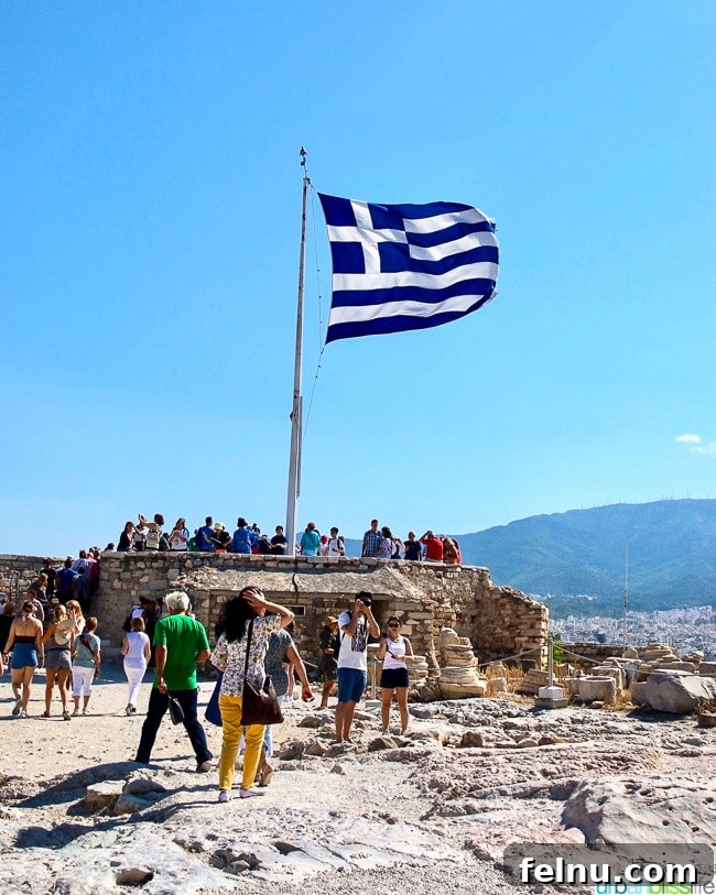 Acropolis Unveiled: Athens Historical Journey 15 Greek flag at the top of the Acropolis