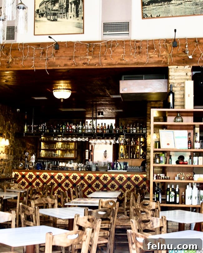 The cozy interior of Dia Tafta restaurant in Monastiraki, Athens, Greece, offering a warm and inviting dining atmosphere
