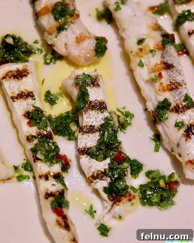 Grilled Mackerel for Babies dish with fresh herbs and olive oil at Nolan restaurant in Athens, Greece.