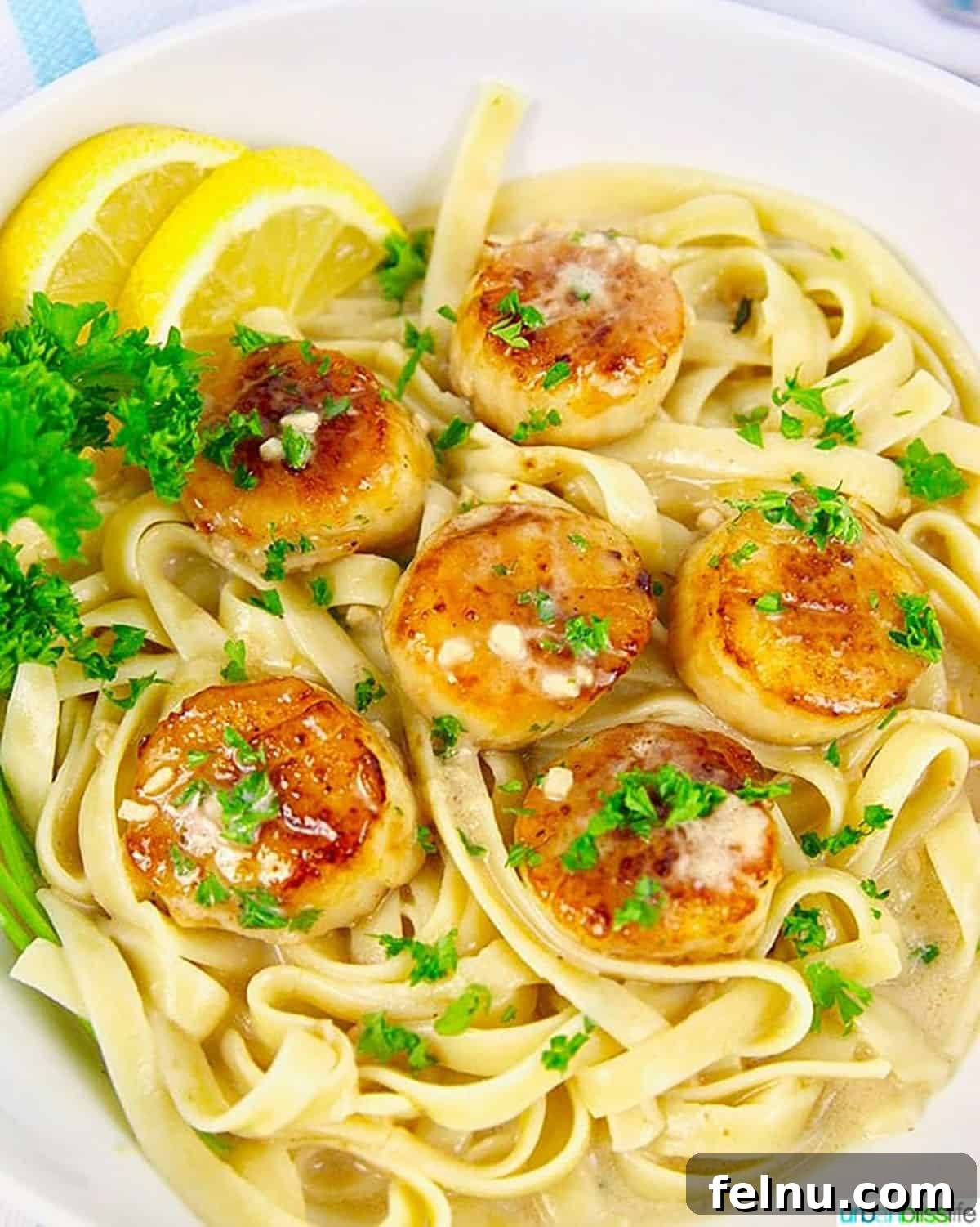 Lemon Garlic Scallop Pasta Dairy-Free Zesty Scallop Pasta: A Dairy-Free Delight 2 Lemon garlic scallop pasta with parsley garnish