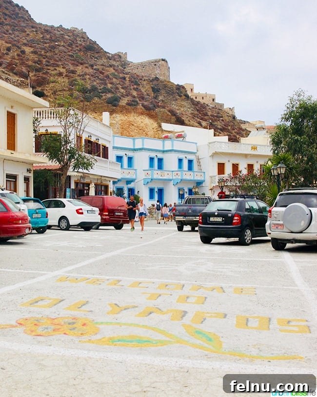 Greece Travel: Discover Olympos Village, Karpathos 9 Cars parked at the entrance to Olympos village on Karpathos, Greece