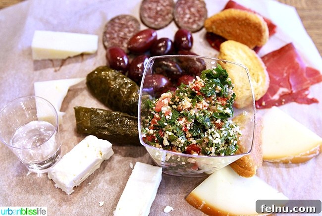 A selection of charcuterie, cheese, dolma, and tzatziki at Miran Deli in Athens, Greece