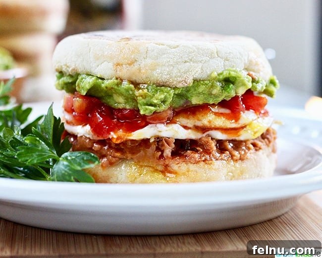 Rancheros Egg Stack 4 Side view of a perfectly constructed Huevos Rancheros Breakfast Sandwich, emphasizing its layers.