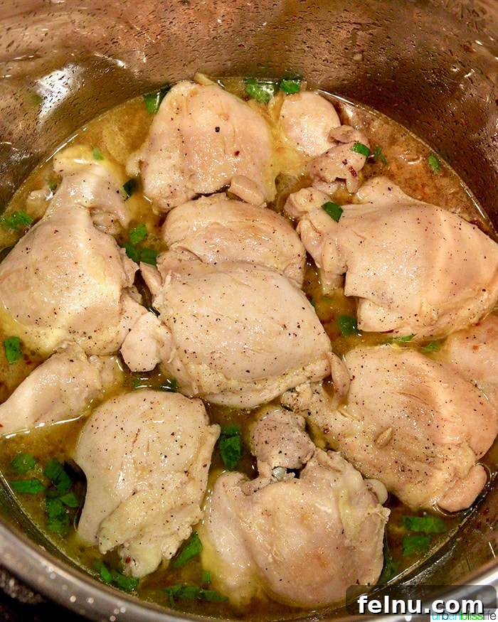 Zesty Instant Pot Lemon Garlic Chicken 5 Chicken thighs cooking and browning in the Instant Pot pressure cooker.