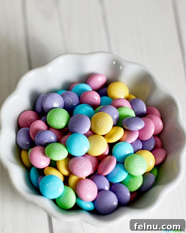 Colossal Chocolate Chunk Cookies 4 Close-up of colorful Easter M&Ms, emphasizing their bright hues and candy-coated texture.