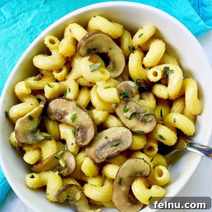 Creamy Vegan Mushroom Pasta in bowl with fork