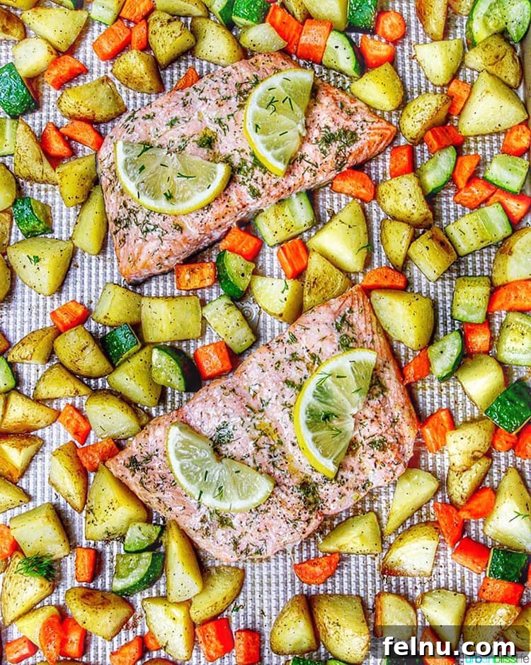 Effortless Oven Baked Salmon and Veggies 2 Flavorful Sheet Pan Salmon with vibrant roasted vegetables arranged on a baking sheet, ready to serve.