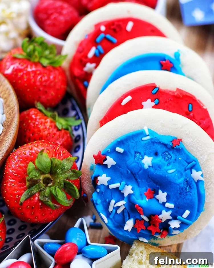 Patriotic Dessert Board 3 Close-up of a 4th of July Dessert Board featuring fresh strawberries and red frosted cookies