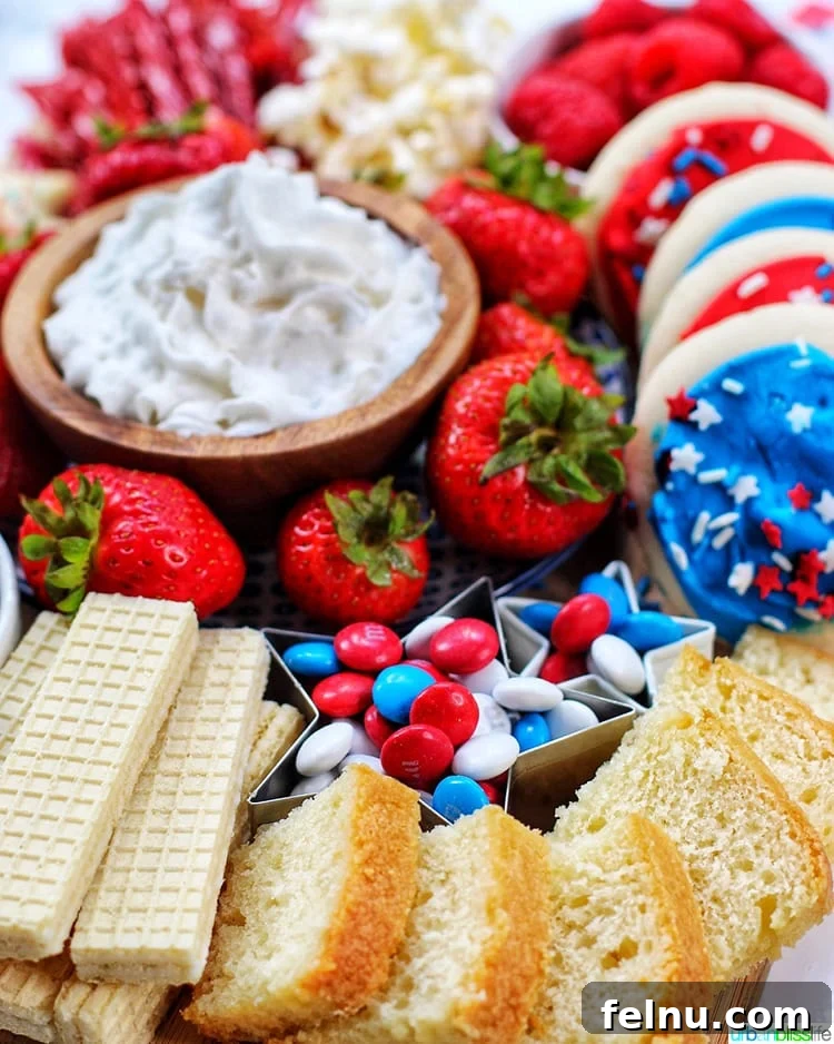 Patriotic Dessert Board 4 Side view of a 4th of July Dessert Board featuring slices of white cake
