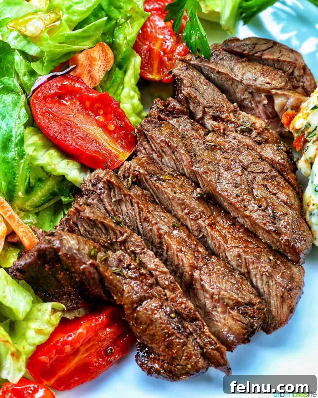 filet mignon sliced with salad.