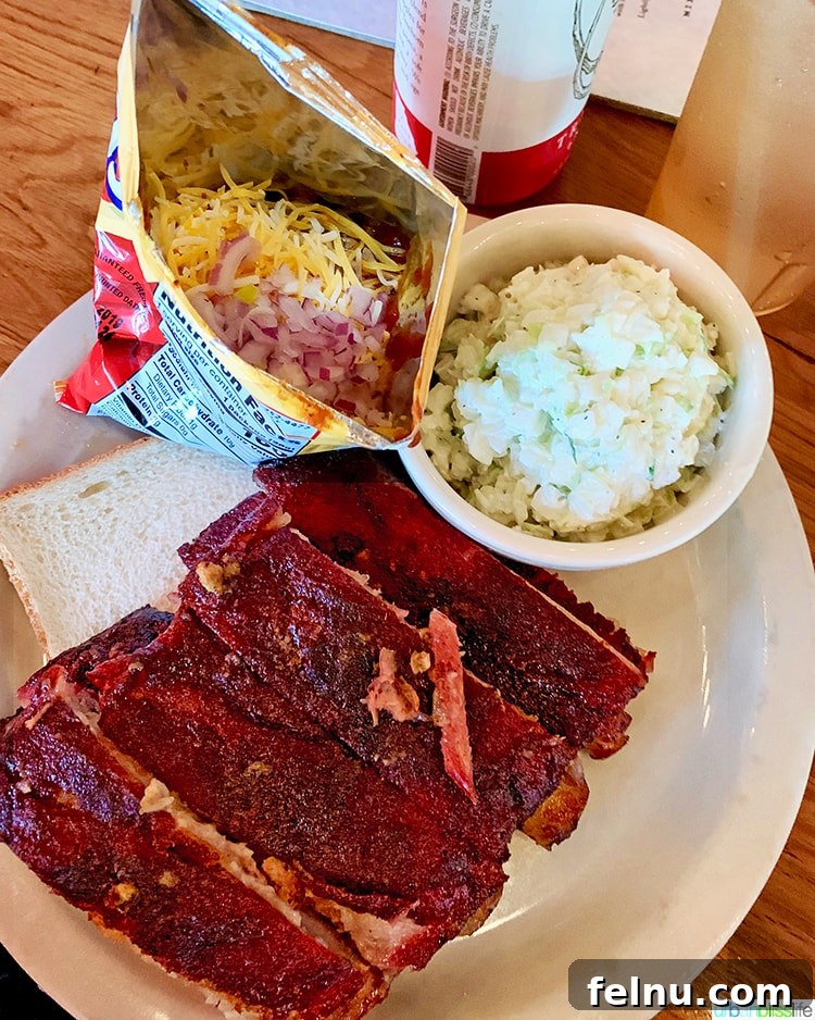 Atlanta's Hottest Dining Destinations 15 A platter of perfectly smoked ribs at Fox Bros BBQ in Atlanta, glistening with their signature sauce.