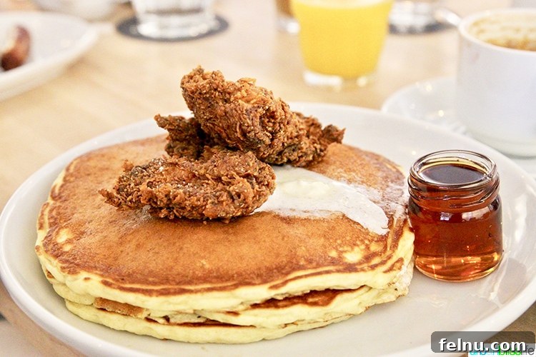 Atlanta's Hottest Dining Destinations 3 A delicious plate featuring crispy fried chicken and fluffy pancakes at Pancake Social in Atlanta, perfect for brunch.