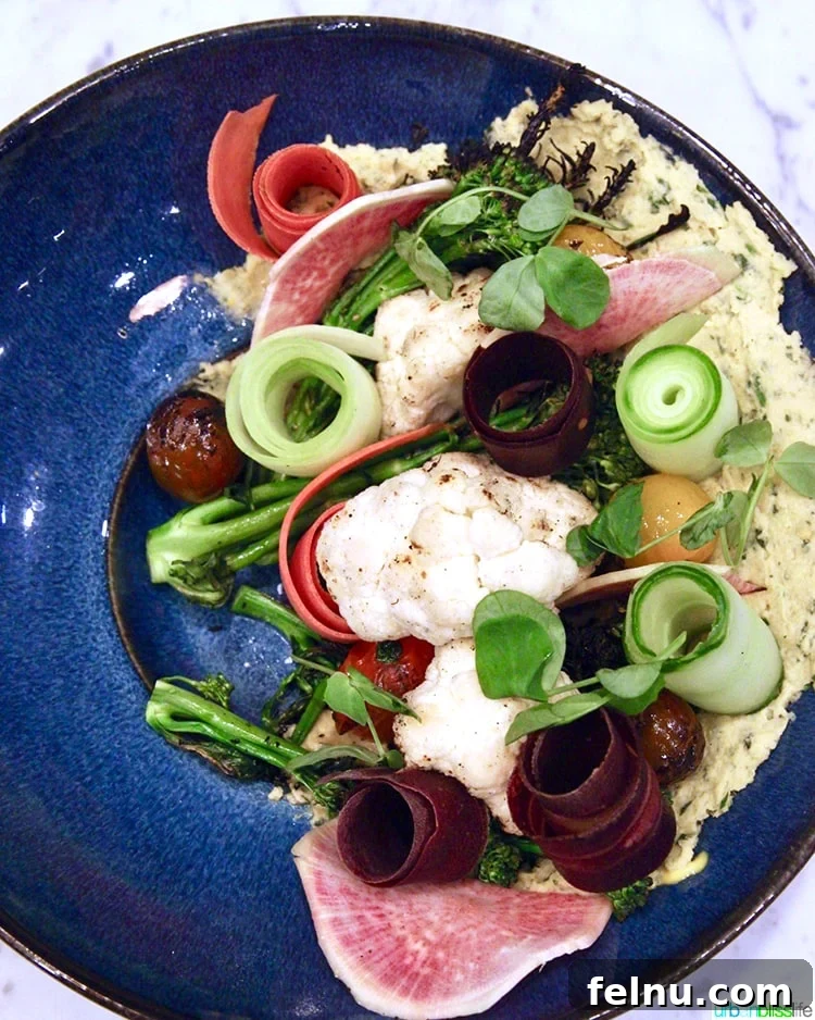 Atlanta's Hottest Dining Destinations 29 A vibrant raw salad with hummus at Local Motives in Atlanta, highlighting fresh ingredients.