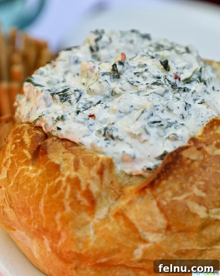 Effortless Creamy Spinach Dip (Dairy-Free) 6 Spinach dip served in a bread bowl, ready to be enjoyed