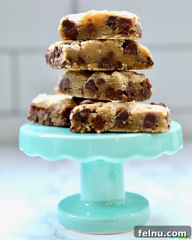 Close-up shot of a stack of freshly baked chocolate chip bars.