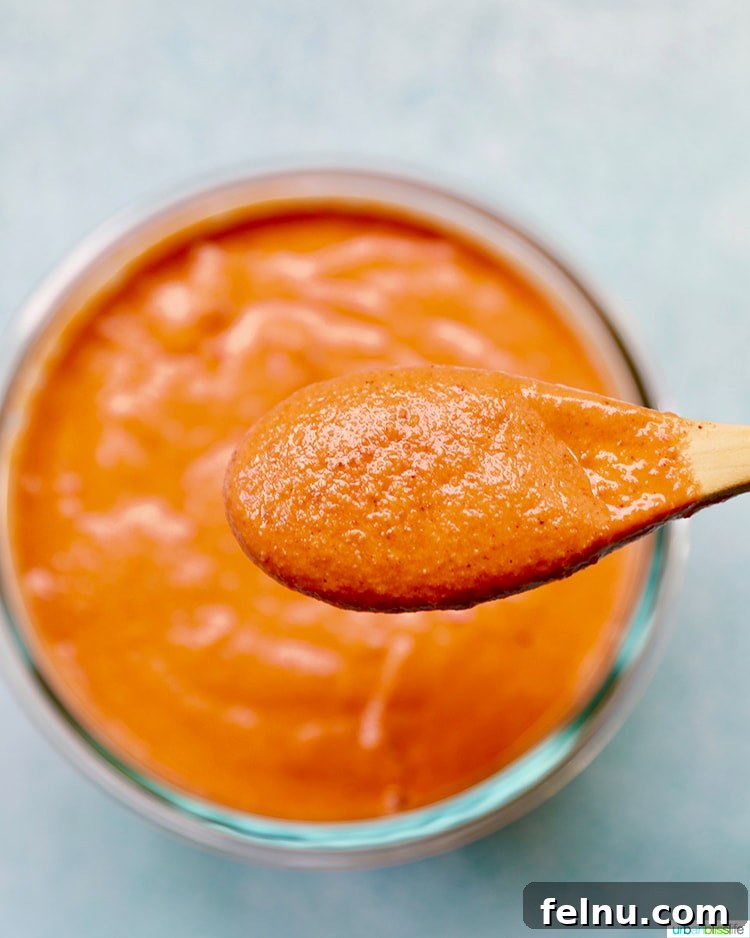 Tangy Romesco Meatballs 4 Freshly made Romesco Sauce in a bowl, showcasing its vibrant orange-red hue.