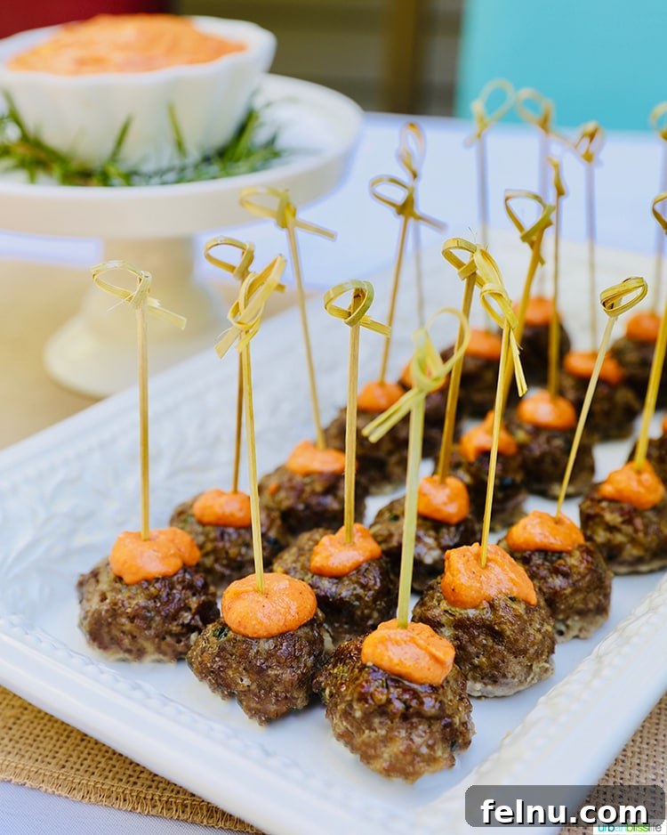 Tangy Romesco Meatballs 6 Meatballs with Romesco Sauce individually speared with food picks for easy serving.
