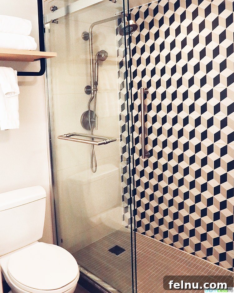 Portland Getaway: A Boutique Hotel Experience 9 Modern shower at The Duniway Hotel Portland, featuring dual showerheads and stylish backsplash.