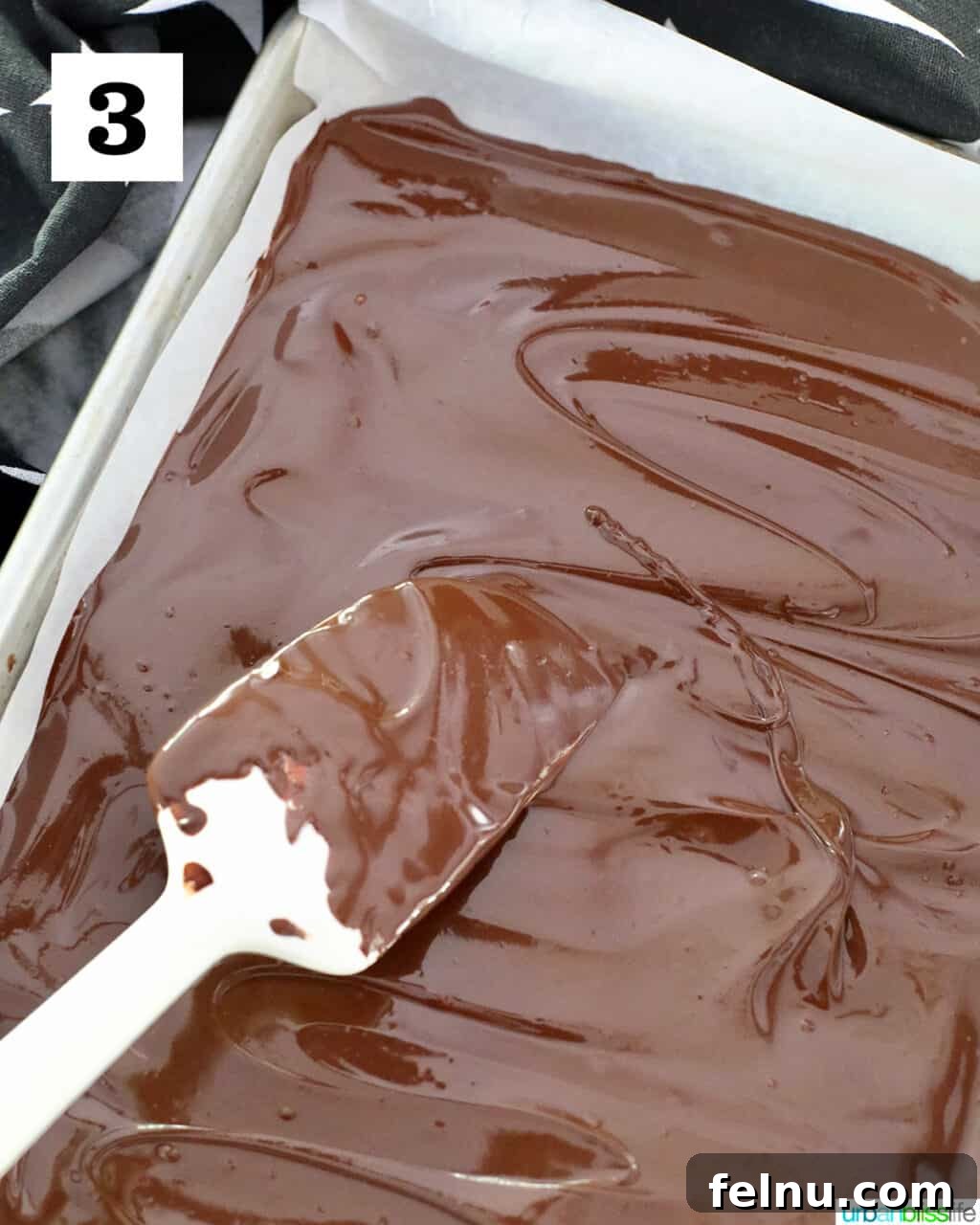 Spreading melted chocolate in sheetpan